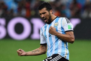 SAO PAULO, BRAZIL - JULY 09: Ezequiel Garay of Argentina celebrates scoring his penalty kick during a shootout during the 2014 FIFA World Cup Brazil Semi Final match between the Netherlands and Argentina at Arena de Sao Paulo on July 9, 2014 in Sao Paulo, Brazil. (Photo by Matthias Hangst/Getty Images)