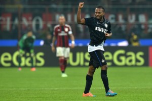 MILAN, ITALY - NOVEMBER 23: Joel Chukwuma Obi of FC Internazionale Milano celebrates his goal during the Serie A match between AC Milan and FC Internazionale Milano at Stadio Giuseppe Meazza on November 23, 2014 in Milan, Italy. (Photo by Valerio Pennicino/Getty Images)