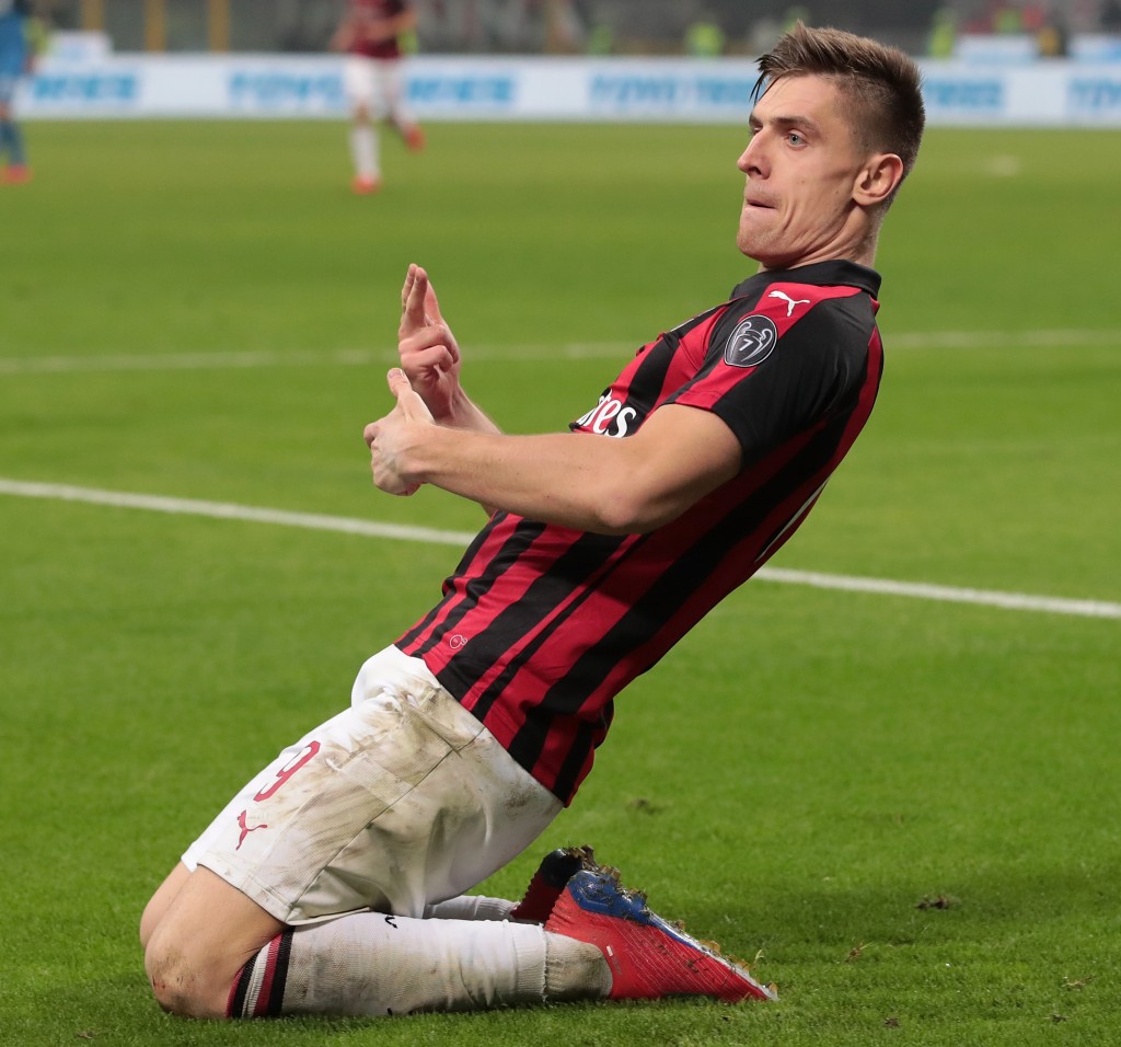 MILAN, ITALY - FEBRUARY 22: Krzysztof Piatek of AC Milan celebrates after scoring the opening goal during the Serie A match between AC Milan and Empoli at Stadio Giuseppe Meazza on February 22, 2019 in Milan, Italy. (Photo by Emilio Andreoli/Getty Images)